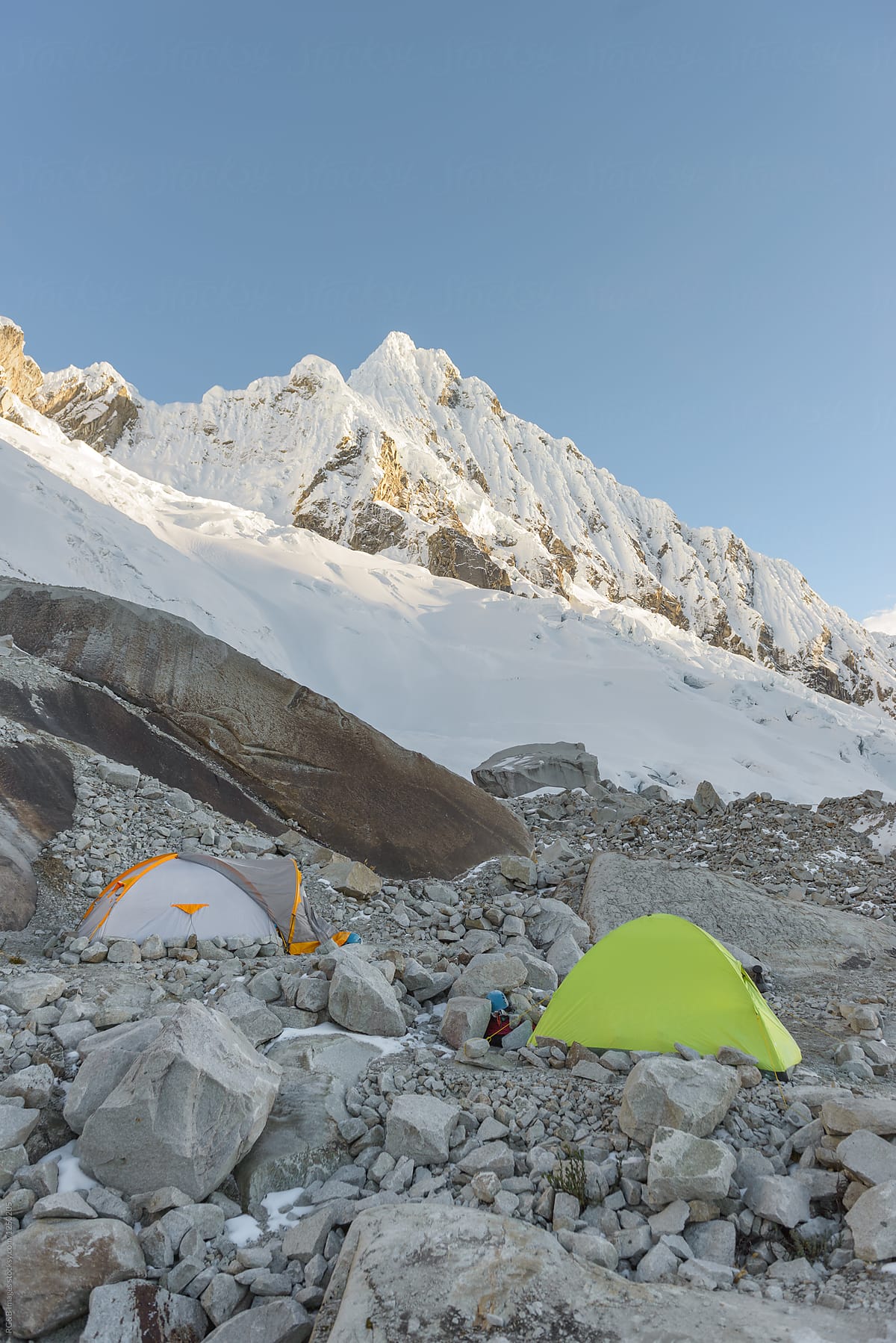 Camping tents at the base of the mountain