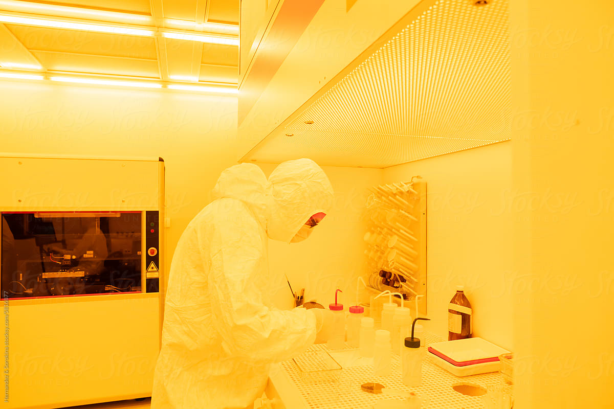 Scientist Working At Yellow Clean Room Chamber