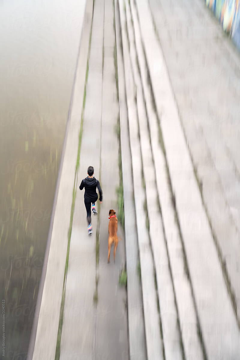 Outdoor run of woman and her dog