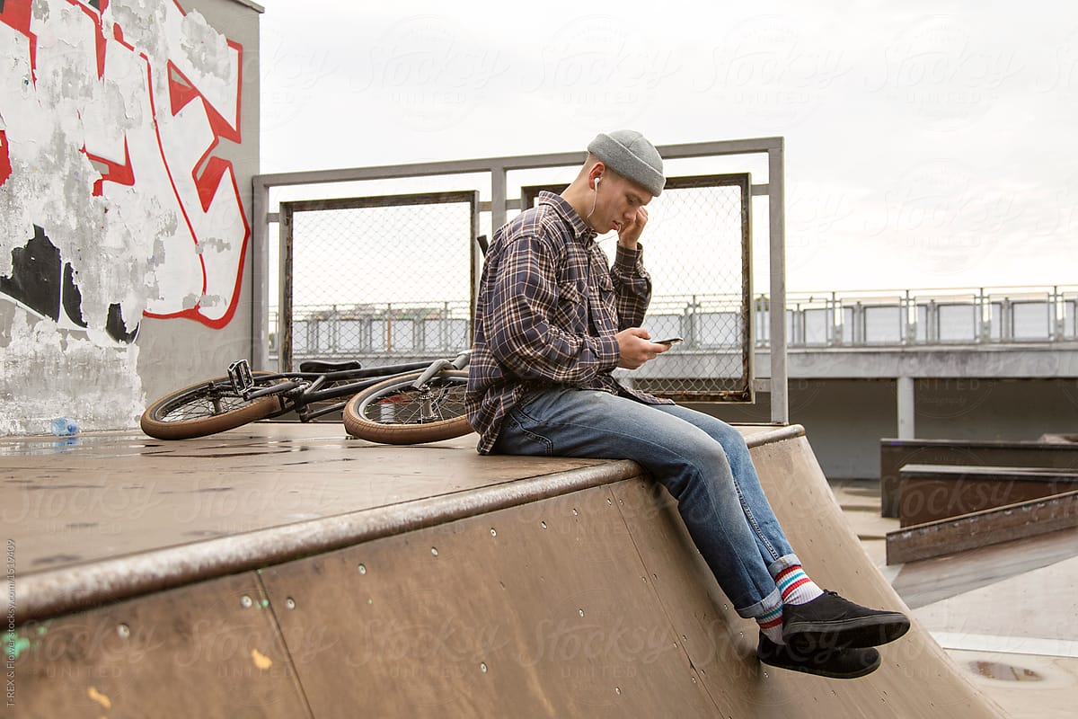 Man listening to music in skatepark