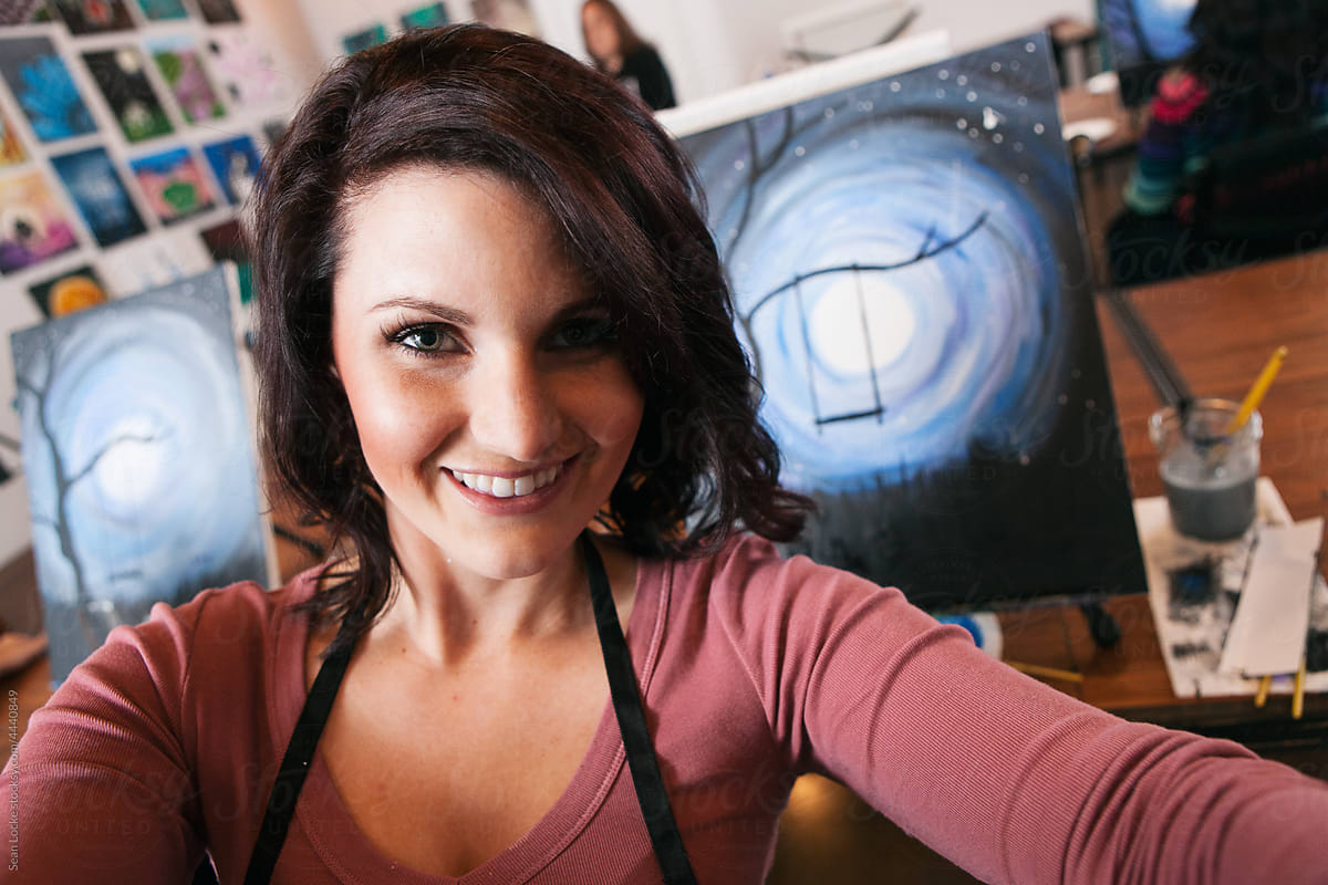 Painting: Woman Takes Selfie With Artwork Behind Her