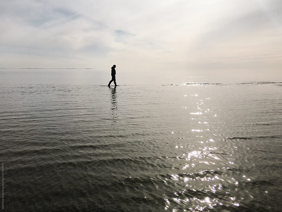 Illusion of man walking on reflective water by Matthew Spaulding ...