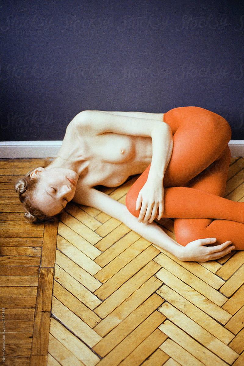 Topless Woman With Red Pantyhose on the wooden floor