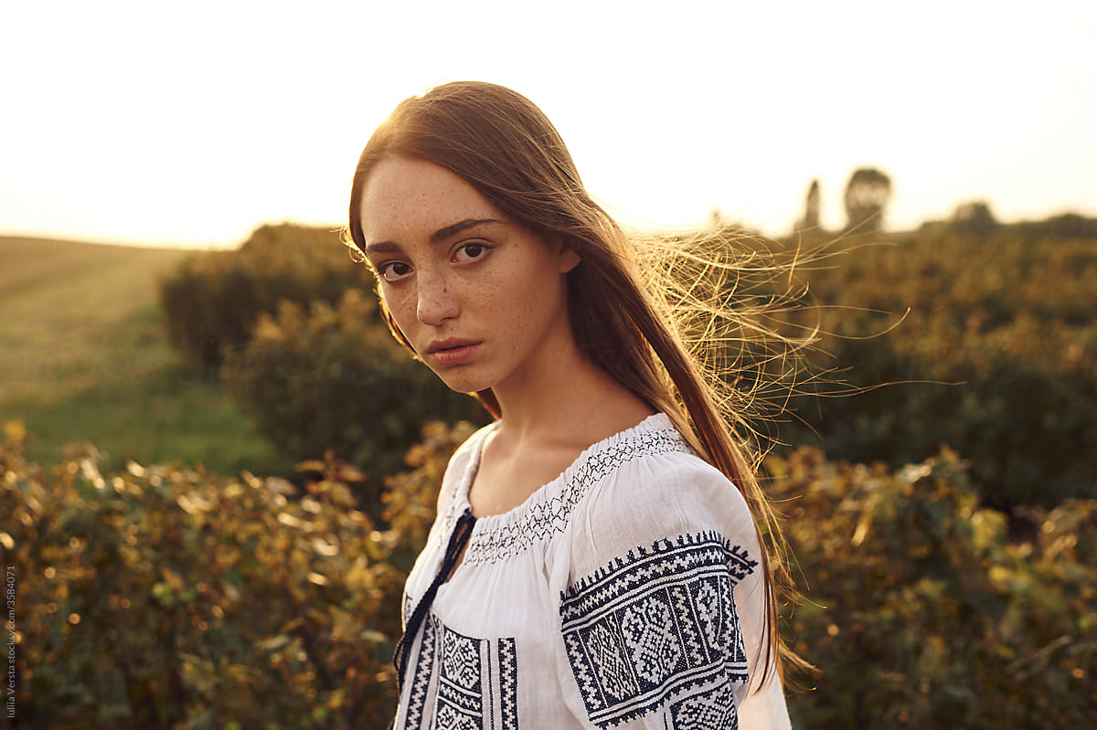 Portrait of red-head ukrainian girl in a field