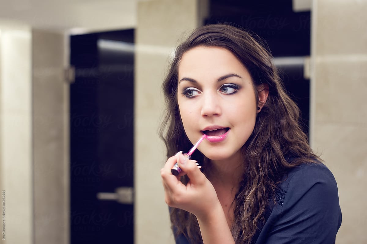 Girl Looking Herself In A Bathroom Mirror Fixing Her Makeup And | Sexiz Pix