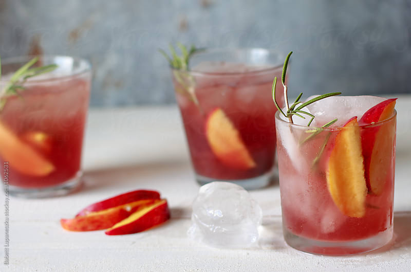 Peach and blood orange cocktail with rosemary