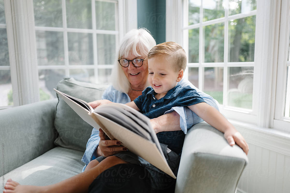 Grandmother Reading With Her Grandson By Stocksy Contributor Jakob Lagerstedt Stocksy