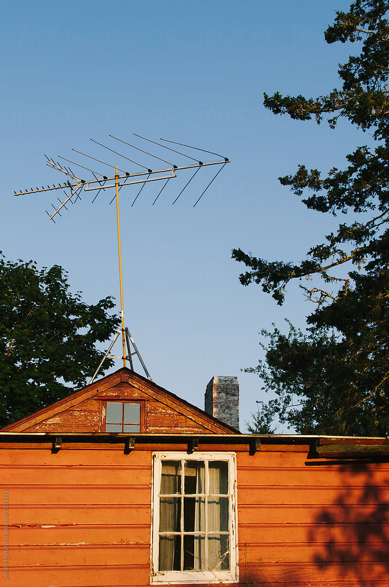 Old Television Antenna On The Roof Of A House By Deirdre Malfatto Stocksy United
