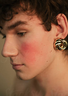 Young Man With Rhinestones On Face by Stocksy Contributor Clique