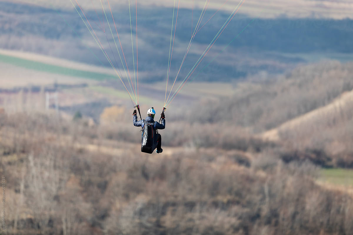 Portrait of a paraglider in the air