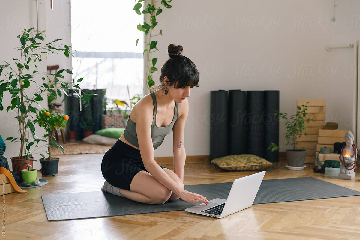 Woman Streaming An Online Yoga Class At Home