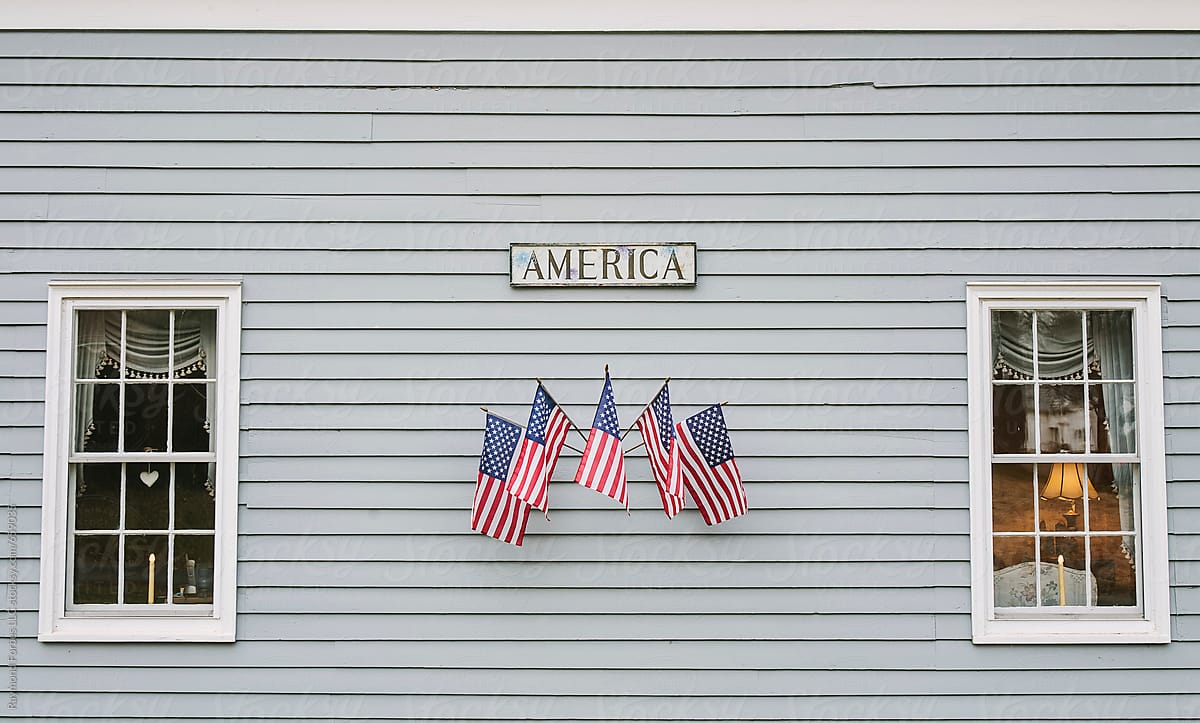 American Flags outside home with America sign