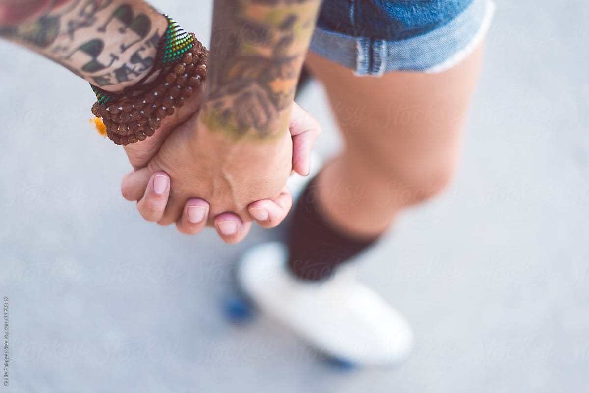Couple holding hands