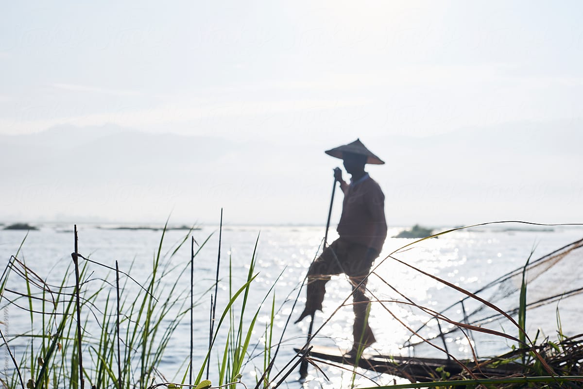 Traditional fisherman standing on boat