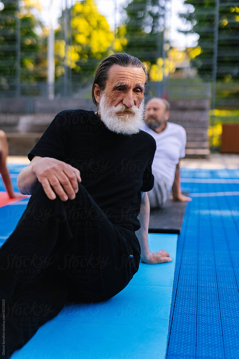 Group of elder person practicing sport exercise outdoor