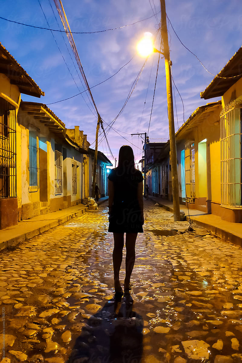 Silhouette of a woman walking alone