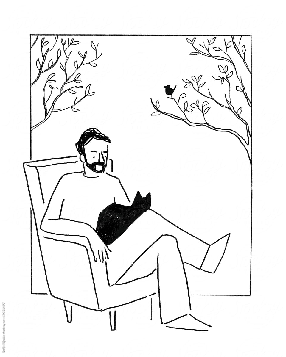 Man with a black cat sitting in a chair
