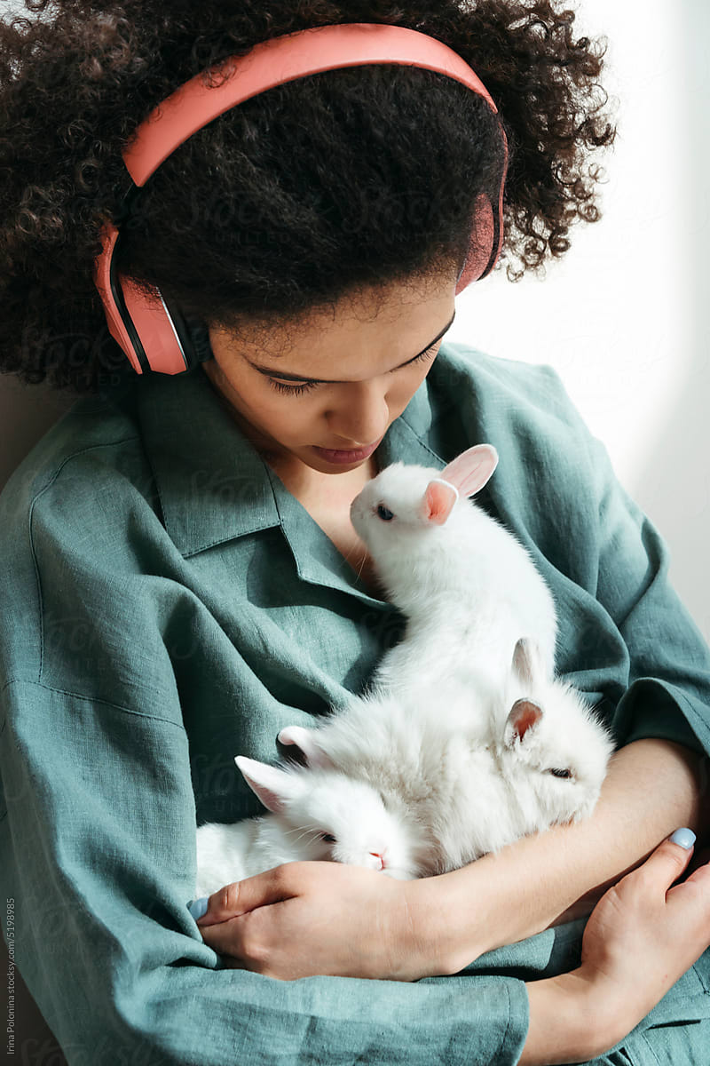 Young woman resting at home with pets.