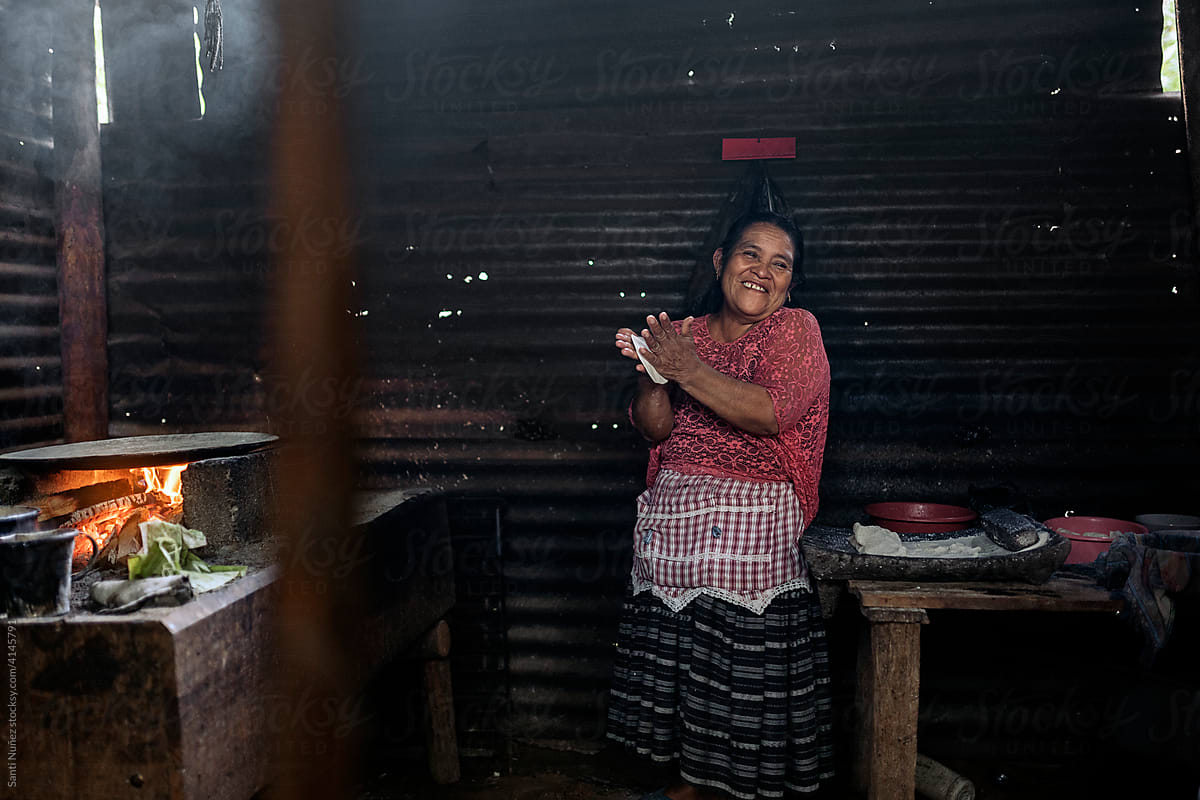 Senior guatemalan woman preparing traditional food