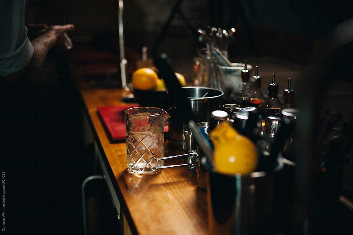 Cocktail preparation in a dark bar
