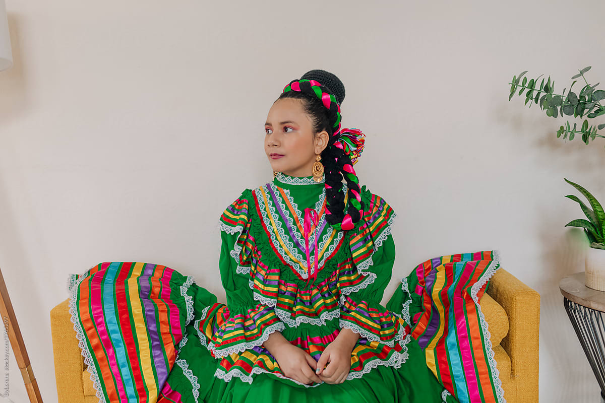 Portrait girl with Mexican dress and braid hairstyle