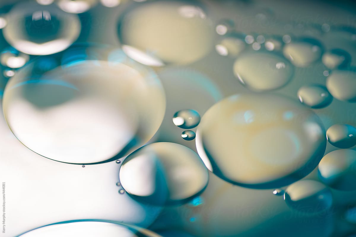 Macro abstract of oil bubbles floating on water