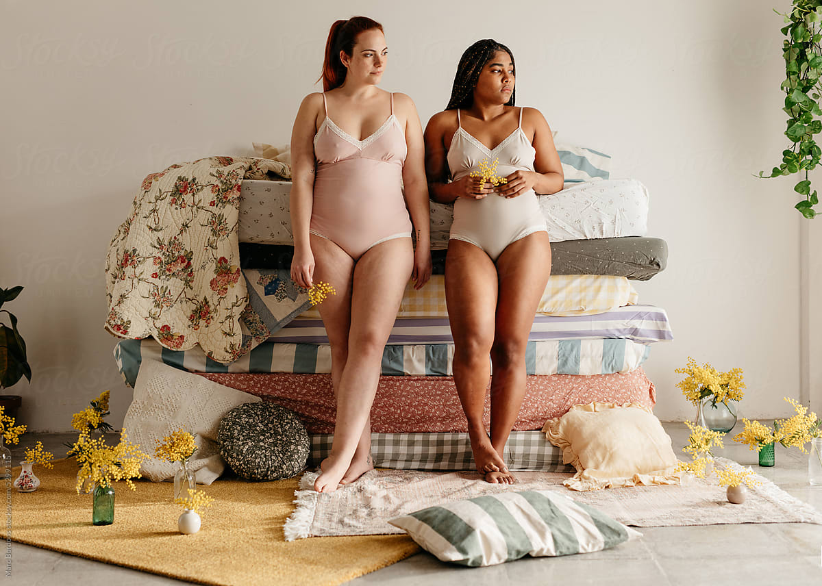 Two Girls In Their Underwear, Next To A Pile Of Colorful Mattresses by  Stocksy Contributor Marc Bordons - Stocksy