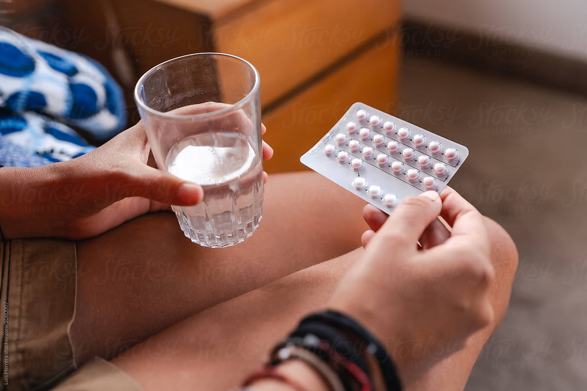 woman taking birth control pills