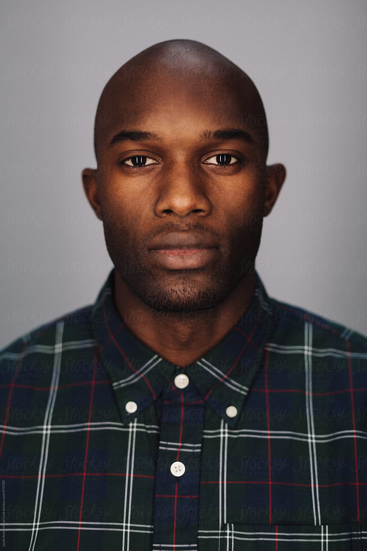 "Close Up Of A Black Young Man Looking At Camera" by Stocksy Contributor "Jacob Lund" - Stocksy
