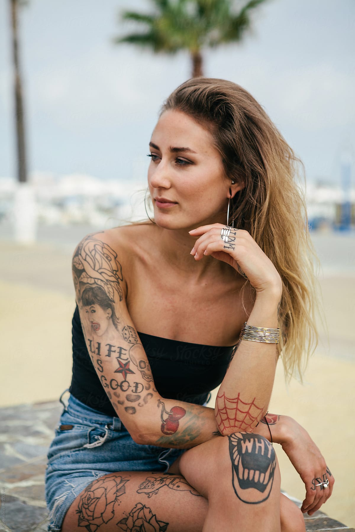Blonde female with toned body and tattoos Stock Photo by ©ianthraves  65050181