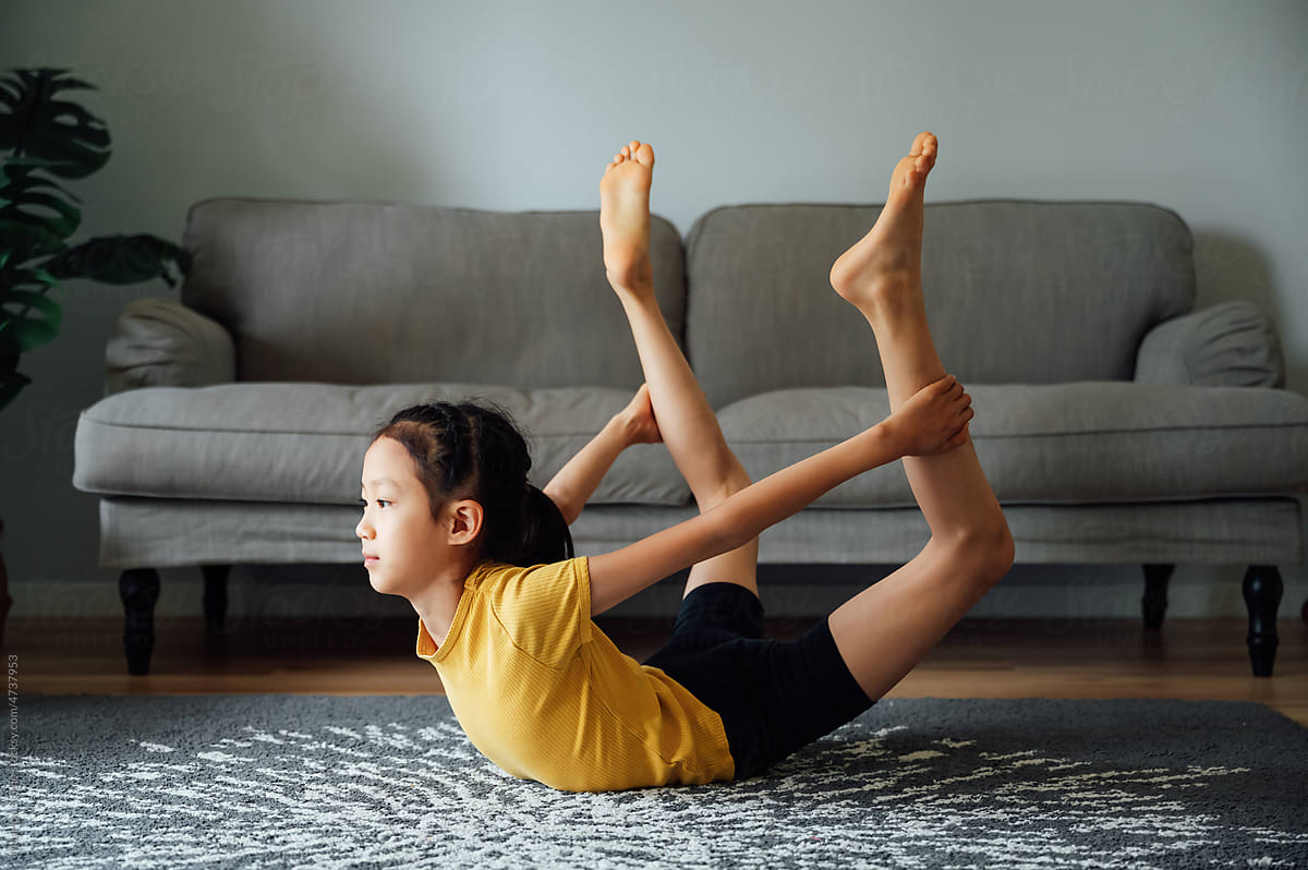 Cute Little Girl Doing Yoga at Home Stock Image - Image of