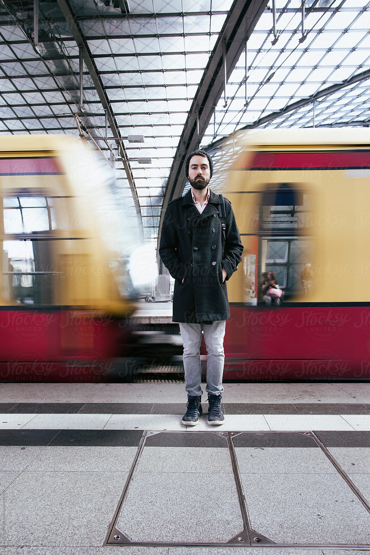 Young Man Standing in Train Station