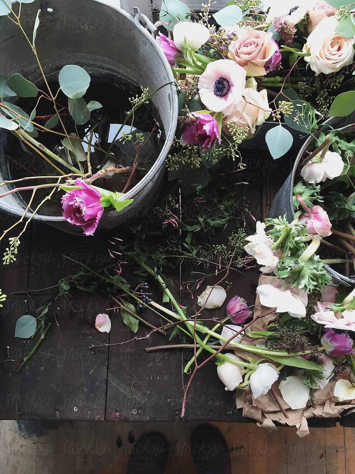 Overhead view of buckets of pretty flowers for arranging in a flower shop