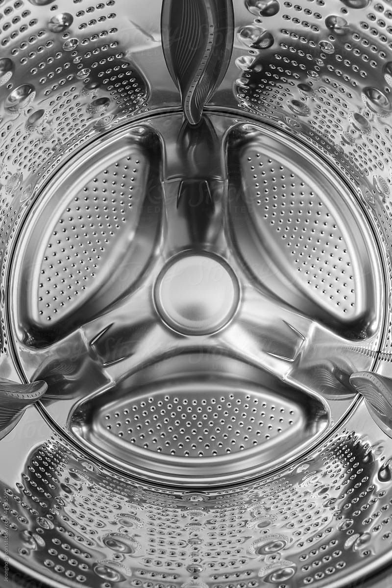 The cylinder inside the washing machine.