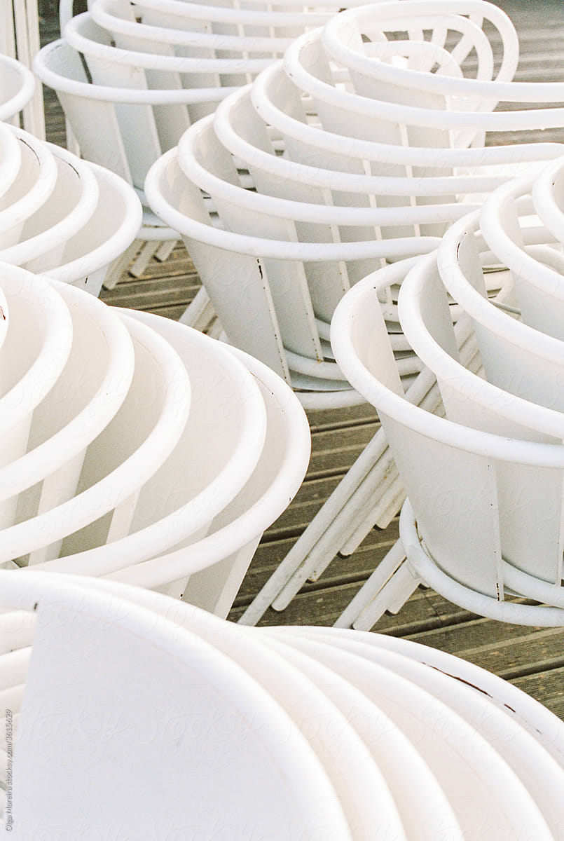 Stacks of white chairs