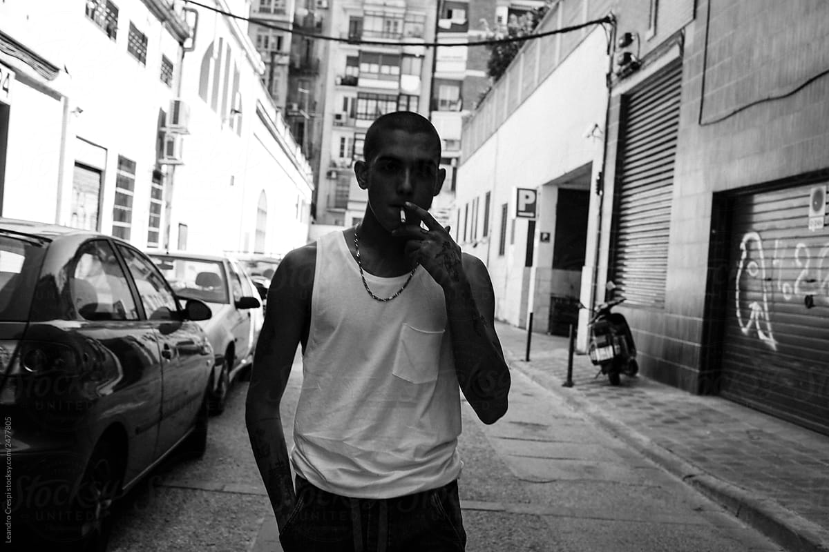 Man smoking in alley