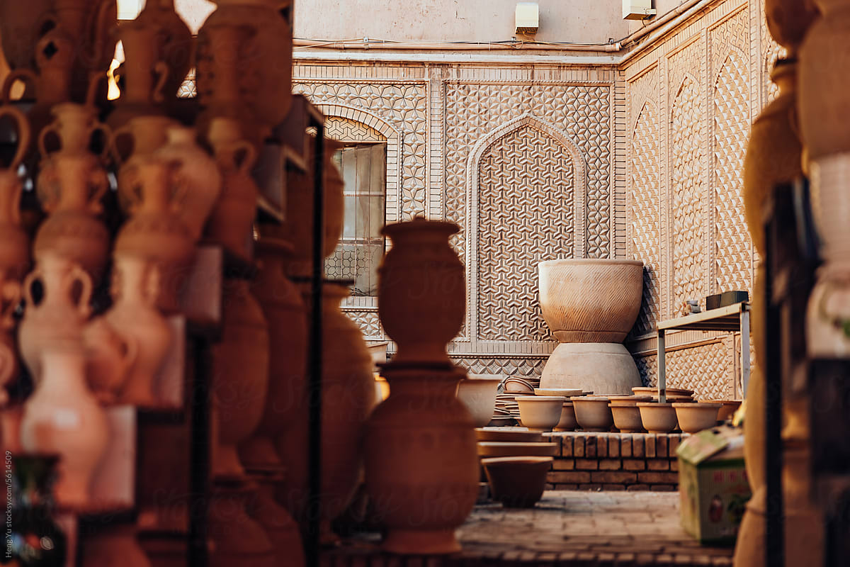 Unfinished Traditional Pottery in Ornate Courtyard