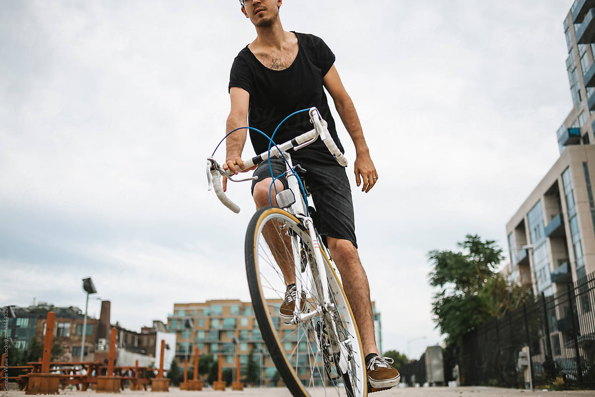 Man riding a bicycle in urban area