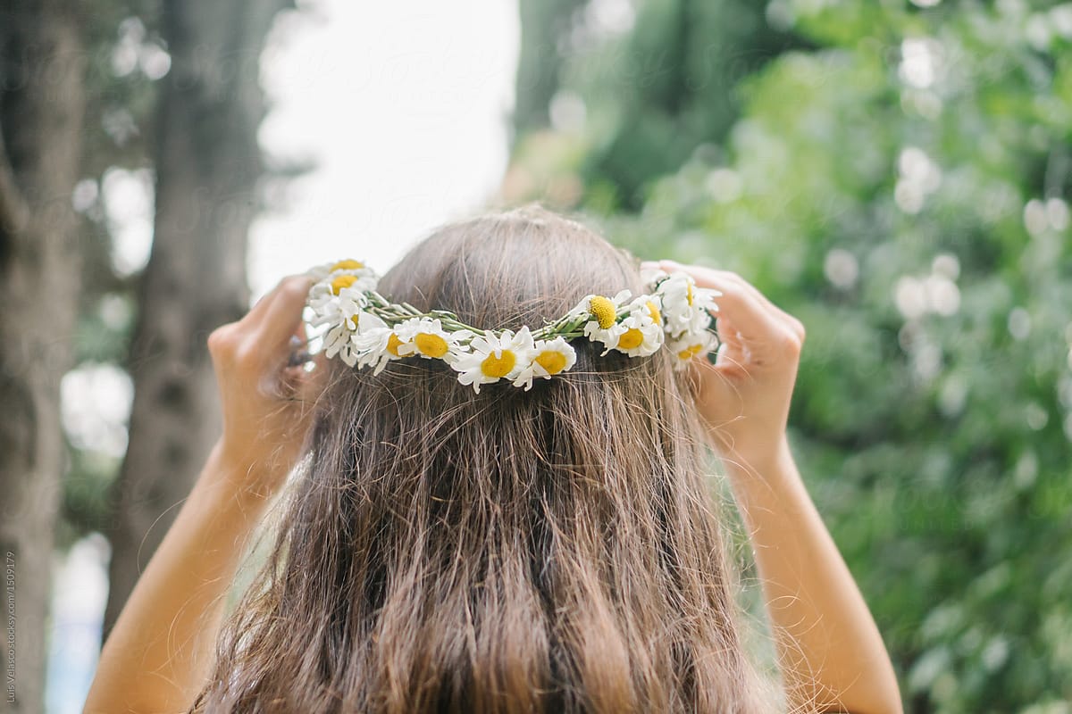 Young girl wearing a homemade floral crown.