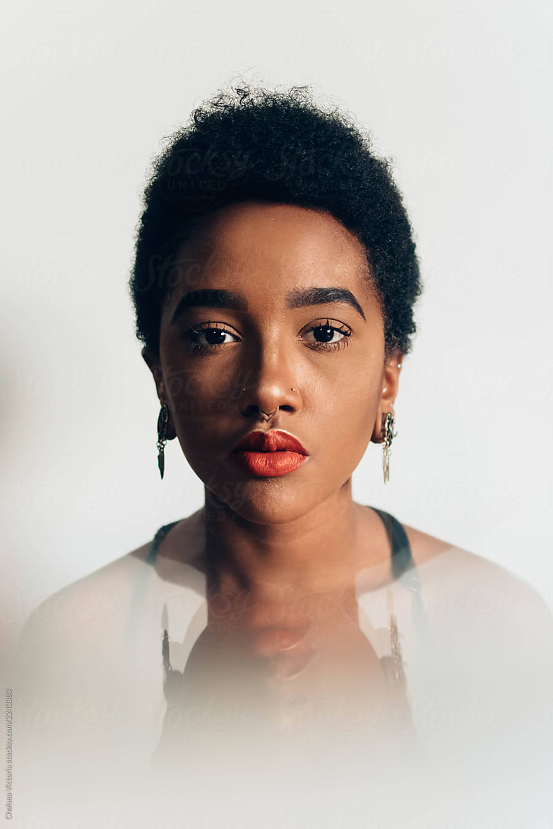 Portraits Of A Beautiful Young Black Woman Against A White Wall By Stocksy Contributor 7643