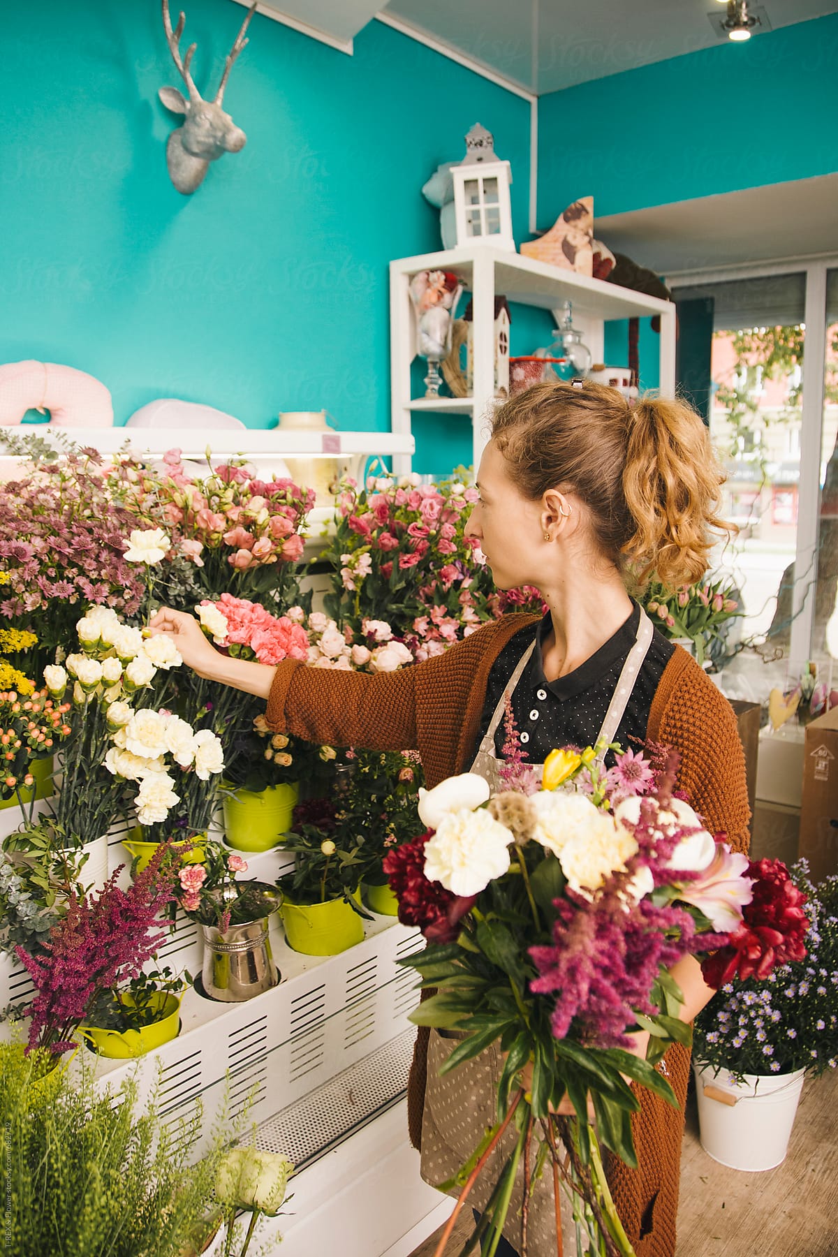 Professional Florist Girl Collecting Flowers by Stocksy Contributor Danil  Nevsky - Stocksy