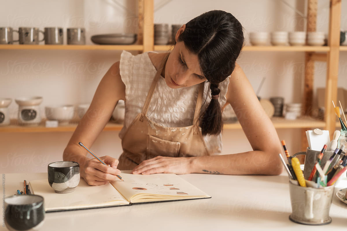 Female Artist Designing A Cup In The Ceramics Studio