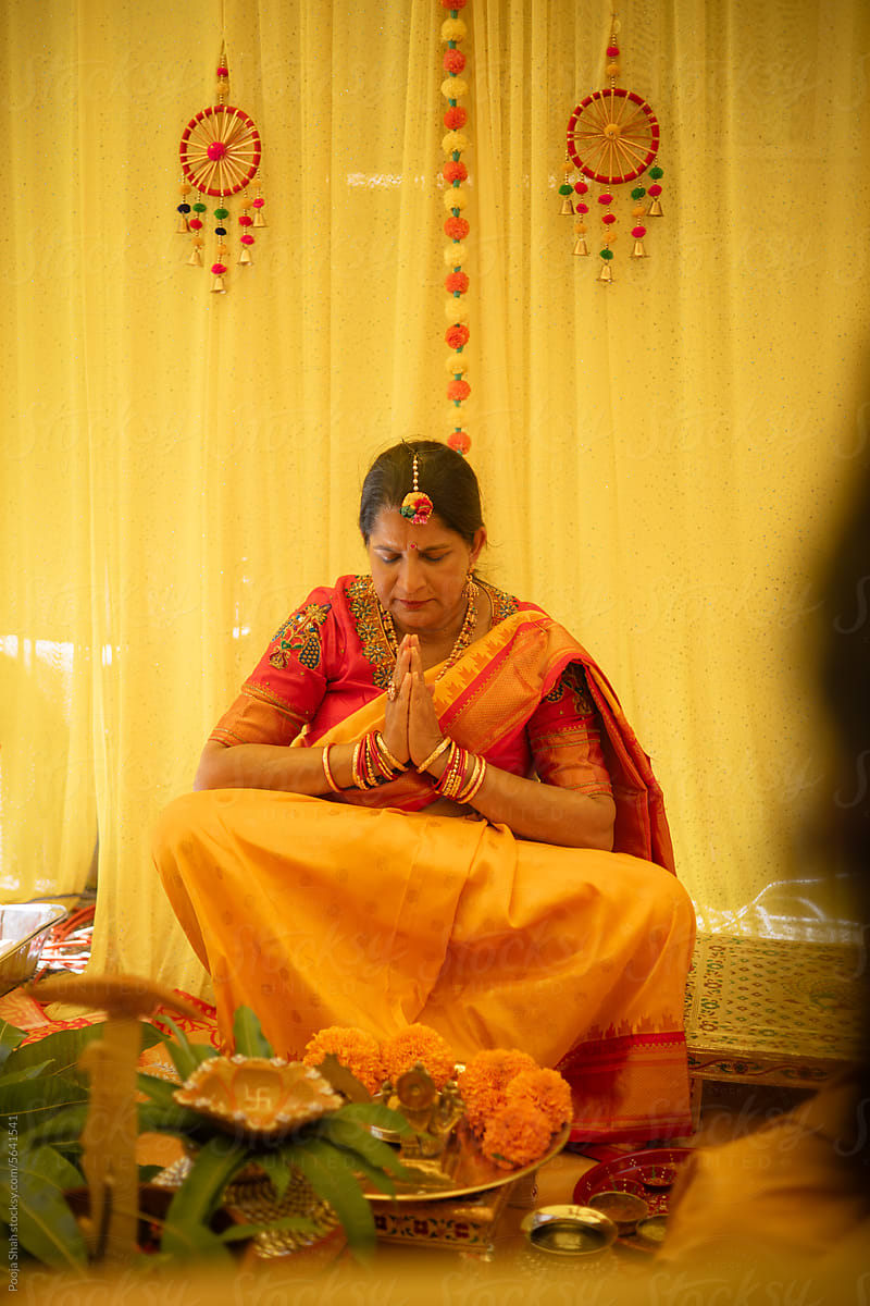 Mother in Prayer Before Wedding Festivities