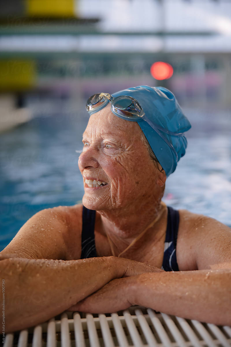 Smiling portrait of senior woman at the pool.