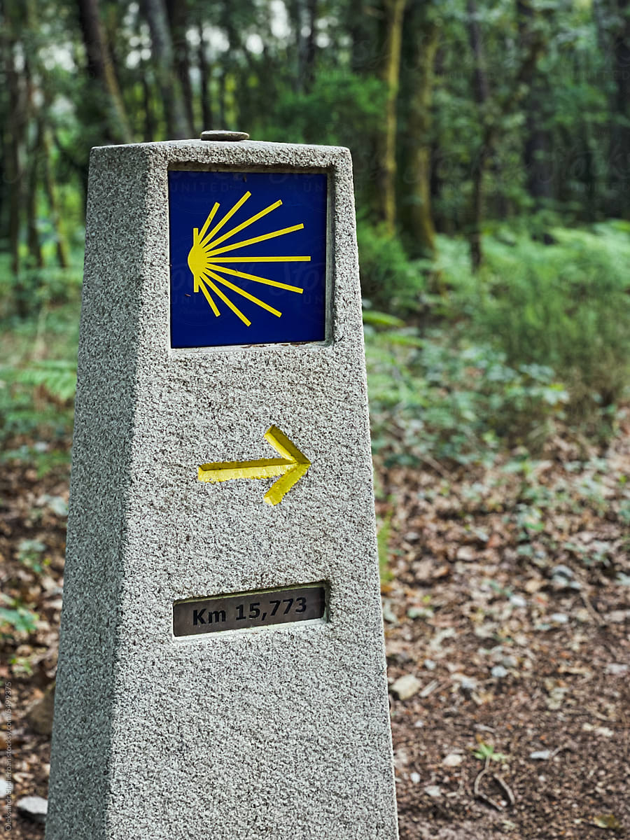 Camino de Santiago stone pointer with yellow arrow