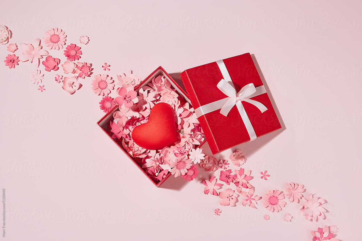 Red heart inside open gift box