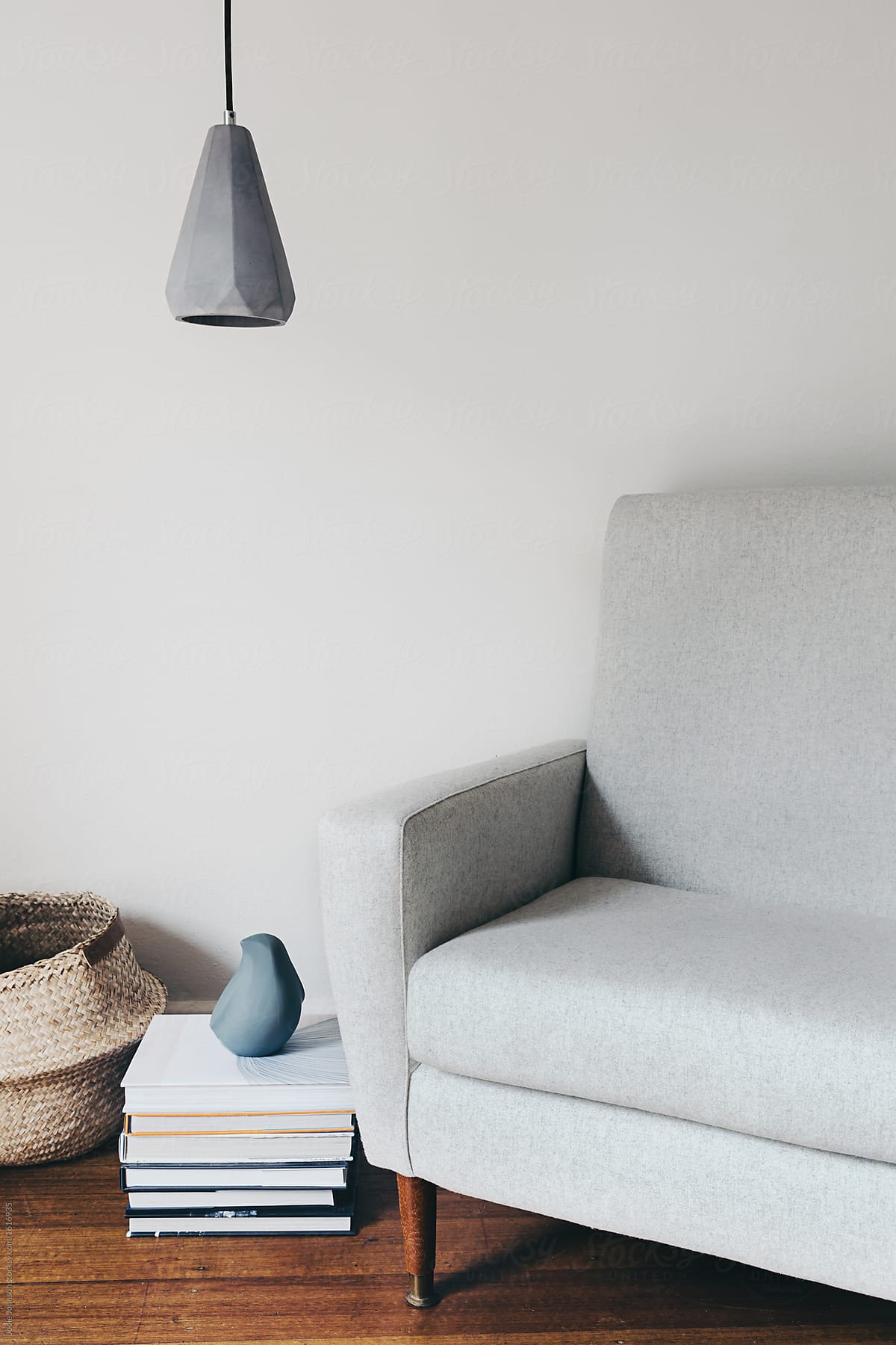 Grey fabric armchair interior setting