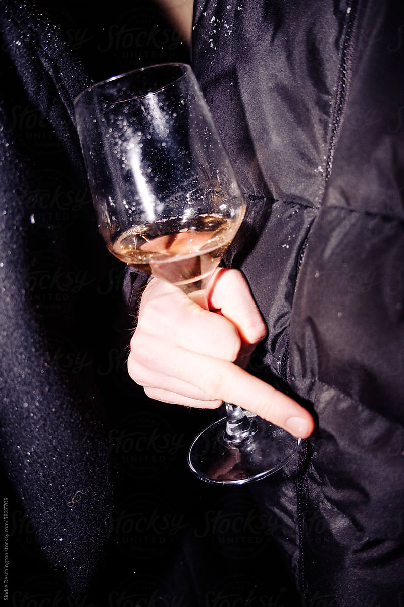 Glass of wine, with raised middle finger