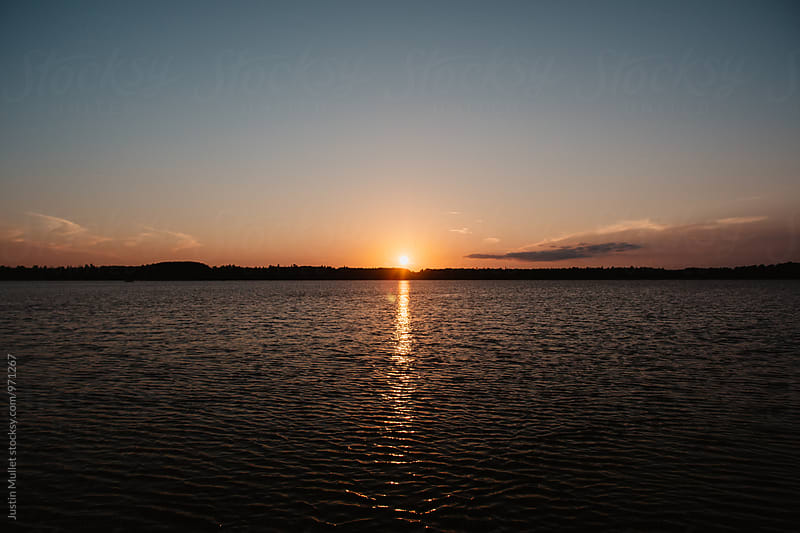 Thin horizon on lake during sunset