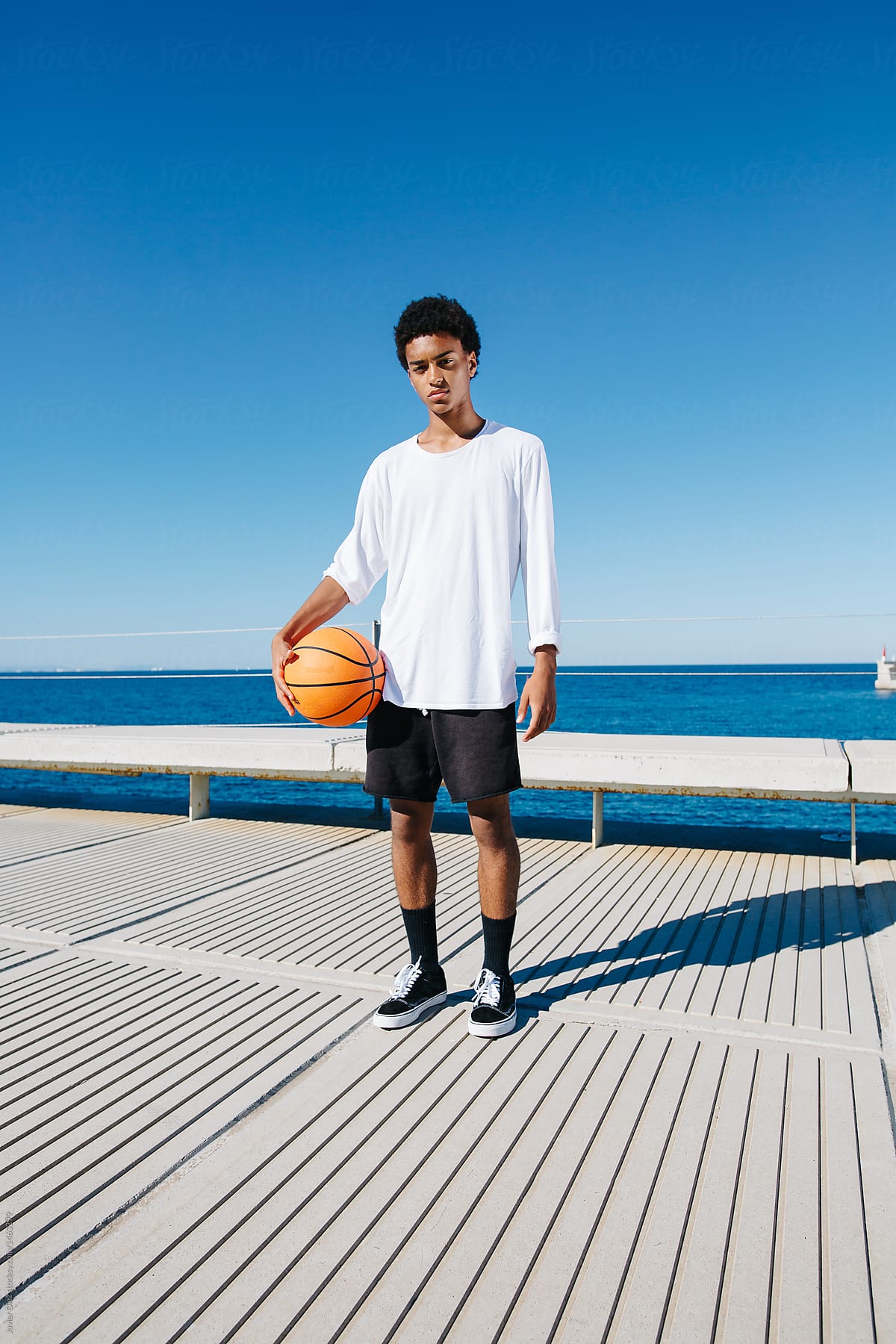 Basketball player at seaside